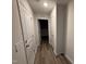 Hallway with multiple doors leading to various rooms at 8 W Emily Gardens Dr, Selma, NC 27576