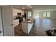 Modern kitchen with stainless steel appliances, granite countertops, and a center island at 8 W Emily Gardens Dr, Selma, NC 27576