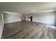 Expansive living room featuring hardwood floors and an open layout at 8 W Emily Gardens Dr, Selma, NC 27576