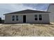 Newly constructed home with a patio and windows overlooking the backyard at 8 W Emily Gardens Dr, Selma, NC 27577