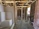 Unfinished bathroom with a white tub/shower installed and plumbing ready for fixtures, awaiting final touches at 8 W Emily Gardens Dr, Selma, NC 27577