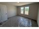 Bedroom featuring neutral wall color and a window that brings in natural light at 8 W Emily Gardens Dr, Selma, NC 27577