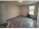 Bright bedroom with plush carpeting and natural light from a large window at 8 W Emily Gardens Dr, Selma, NC 27577
