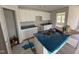 Kitchen featuring white cabinets and an island with a stainless steel sink at 8 W Emily Gardens Dr, Selma, NC 27577