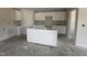 Unfinished spacious kitchen featuring white cabinets, center island, and ample space for customization at 8 W Emily Gardens Dr, Selma, NC 27577
