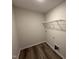 Dedicated laundry room with hookups, shelving, and neutral wall color ready for appliances at 8 W Emily Gardens Dr, Selma, NC 27577