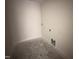 An ample-sized laundry room featuring necessary hookups for efficient laundry appliance installation at 8 W Emily Gardens Dr, Selma, NC 27577