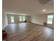 Spacious living room featuring wood-look floors, recessed lighting and large windows at 8 W Emily Gardens Dr, Selma, NC 27577