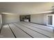 Open-concept living space connecting the living room, kitchen and outdoor access at 8 W Emily Gardens Dr, Selma, NC 27577