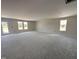 Bright and airy living room with plenty of natural light streaming through the double set of windows at 8 W Emily Gardens Dr, Selma, NC 27577