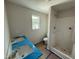 Bathroom featuring double sinks, white cabinets, and a shower, providing a spa-like experience at 82 W Emily Gardens Dr, Selma, NC 27576