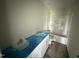 Clean bathroom featuring double sinks, white cabinets, and a tub and shower combination at 82 W Emily Gardens Dr, Selma, NC 27576