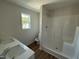 Bathroom featuring modern finishes, double sinks, a shower and vinyl flooring at 82 W Emily Gardens Dr, Selma, NC 27576