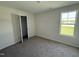 Cozy bedroom with a large window and closet, providing ample natural light at 82 W Emily Gardens Dr, Selma, NC 27576