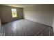 Empty bedroom with window and wall outlets, new carpeting at 82 W Emily Gardens Dr, Selma, NC 27576