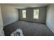 Comfortable bedroom with plush carpeting and natural light from a double window at 82 W Emily Gardens Dr, Selma, NC 27576