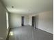 Comfortable bedroom with natural light, neutral paint, and plush carpet, ideal for restful nights at 82 W Emily Gardens Dr, Selma, NC 27576