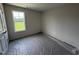 Bright bedroom with a large window, offering serene views and abundant natural light at 82 W Emily Gardens Dr, Selma, NC 27576