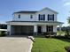 Charming two-story home with a spacious two car garage and well-maintained lawn at 82 W Emily Gardens Dr, Selma, NC 27576
