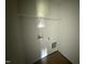 Dedicated laundry room with convenient hookups and shelving for storage at 82 W Emily Gardens Dr, Selma, NC 27576