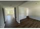 Bright living room featuring new flooring, fresh paint, and ample natural light from the window at 82 W Emily Gardens Dr, Selma, NC 27576