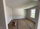 Bright living room featuring large windows and neutral paint, perfect for relaxation and entertaining at 82 W Emily Gardens Dr, Selma, NC 27576