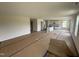 Open-concept living space with a view of a modern kitchen featuring white cabinets at 82 W Emily Gardens Dr, Selma, NC 27576