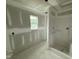 Modern bathroom showcasing prepped drywall, single window and a stand up shower at 82 W Emily Gardens Dr, Selma, NC 27577