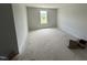 Bedroom with fresh paint, covered floors, and a bright window at 82 W Emily Gardens Dr, Selma, NC 27576