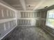 Unfinished bedroom features a window and a smooth, level floor at 82 W Emily Gardens Dr, Selma, NC 27577