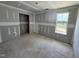 Under-construction bedroom featuring a framed window and doorway awaiting final touches at 82 W Emily Gardens Dr, Selma, NC 27577