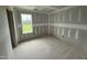Cozy bedroom showcases drywall, a window, and a doorway for personalized design at 82 W Emily Gardens Dr, Selma, NC 27577