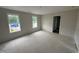 Spacious bedroom featuring natural light, fresh paint, and covered floors at 82 W Emily Gardens Dr, Selma, NC 27576