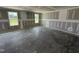 Spacious unfinished bedroom with natural light from the two double windows at 82 W Emily Gardens Dr, Selma, NC 27577