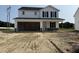 New two-story home with a two-car garage and newly landscaped front yard at 82 W Emily Gardens Dr, Selma, NC 27577