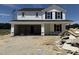 New construction home with white siding, black shutters, and an attached two-car garage at 82 W Emily Gardens Dr, Selma, NC 27577