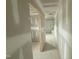 Hallway view showcasing door frames and leading to a bathroom with prepped drywall and fixtures at 82 W Emily Gardens Dr, Selma, NC 27577