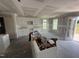 Bright unfinished kitchen boasts white cabinets and an island at 82 W Emily Gardens Dr, Selma, NC 27577