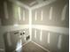 Compact laundry room awaiting fixtures, offering functionality and convenience at 82 W Emily Gardens Dr, Selma, NC 27577