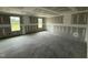 Spacious living room showcasing new construction with drywall and two bright windows at 82 W Emily Gardens Dr, Selma, NC 27577