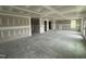 Expansive living area featuring drywall, and ample natural light from several windows at 82 W Emily Gardens Dr, Selma, NC 27577