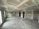 Open-concept living area displays drywall, several windows and doorway access to other rooms at 82 W Emily Gardens Dr, Selma, NC 27577