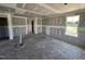 Unfinished living room with large windows for natural light, awaiting personal touches at 82 W Emily Gardens Dr, Selma, NC 27577