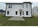 Exterior showcasing a patio and a large backyard with lush grass at 83 W Emily Gardens Dr, Selma, NC 27576