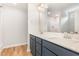 Bright bathroom with double sinks and vanity with solid surface countertops at 83 W Emily Gardens Dr, Selma, NC 27576