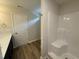 Compact bathroom featuring a white shower and vanity with door to water closet at 83 W Emily Gardens Dr, Selma, NC 27576