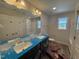Bathroom featuring double sink vanity, large mirror and fixtures at 83 W Emily Gardens Dr, Selma, NC 27576