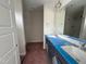 A modern bathroom features dual sinks, a large mirror, and an enclosed shower at 83 W Emily Gardens Dr, Selma, NC 27576