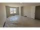 Bedroom with a window and view of neighborhood, plus closet at 83 W Emily Gardens Dr, Selma, NC 27576