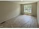 Bedroom with carpet, neutral walls, window with tree view at 83 W Emily Gardens Dr, Selma, NC 27576